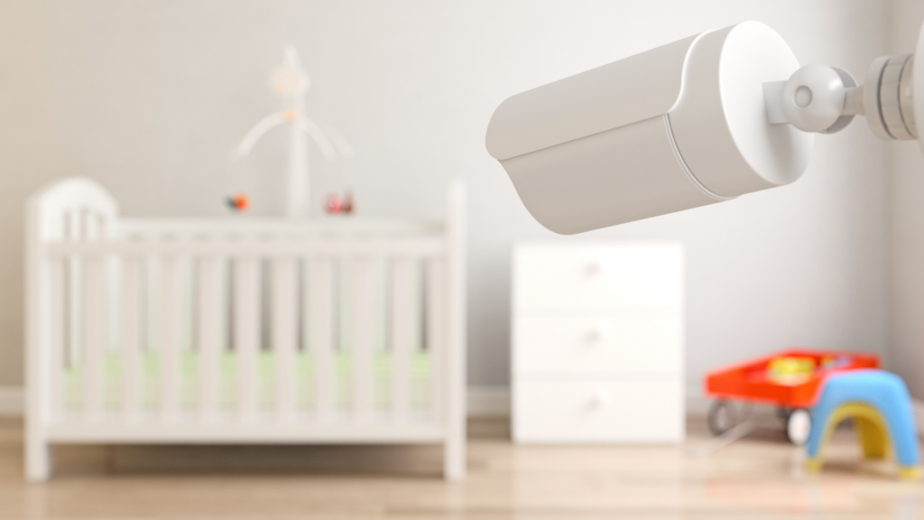 A nursery, a crib in front of a camera demonstrating safety for your little one
